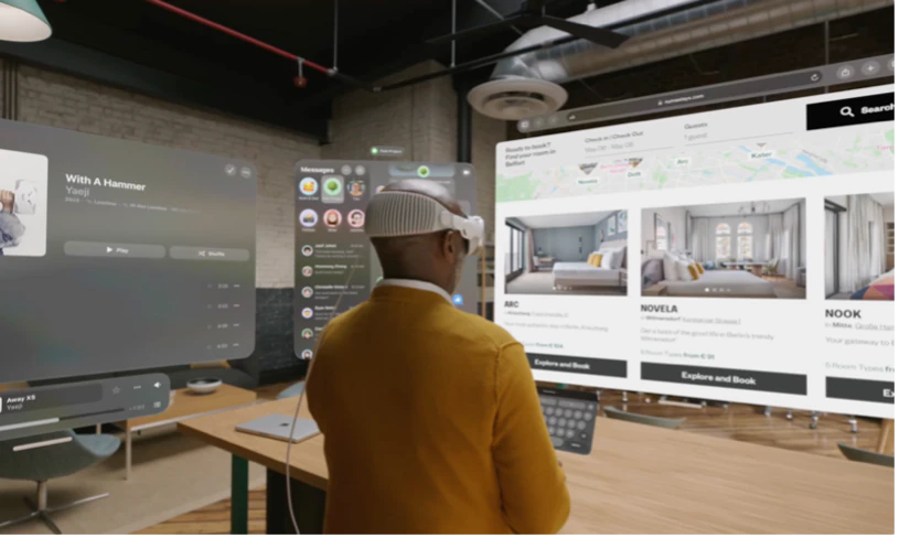 App windows floating in a room, seen through Vision Pro