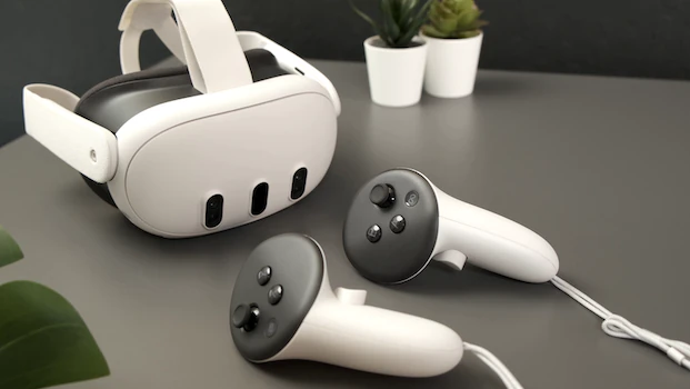 A Meta Quest 3 headset with its controllers